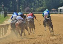 Horses racing on the dirt