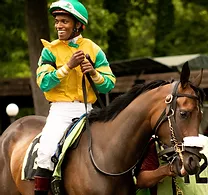 Image of jockey on racehorse